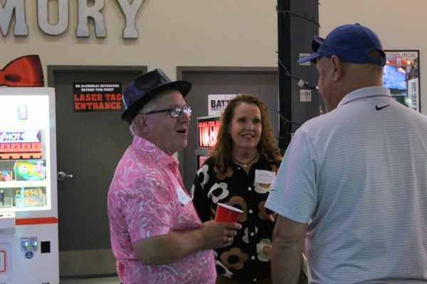 2 men and 1 woman chatting in bgr