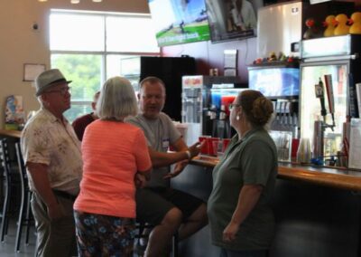 BGR Corporate group of 4 people standing at bar
