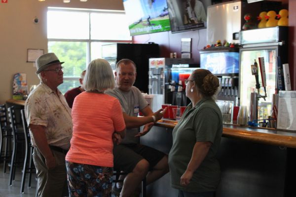 BGR Corporate group of 4 people standing at bar
