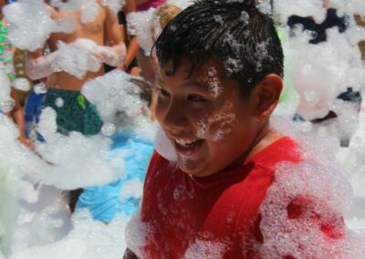 Boy laughing at bubble pit