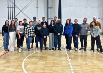 Group event photo of 20+ people smiling from BGR