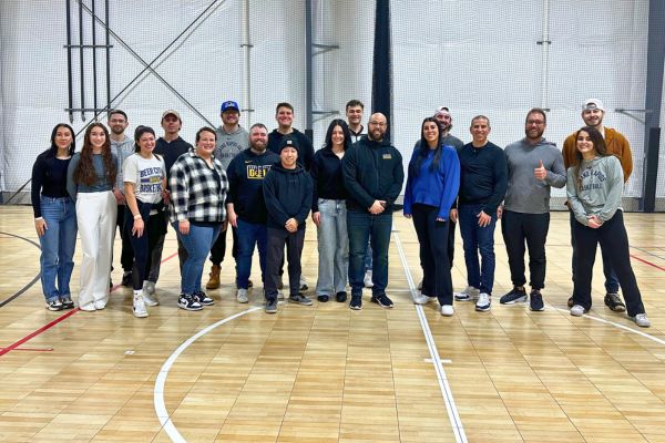 Group event photo of 20+ people smiling from BGR
