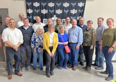 Group of adults in front of bgr banner