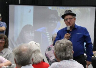 Man speaking to group at retirement party