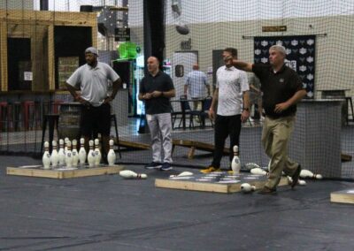 Throw bowling image with 3 men playing