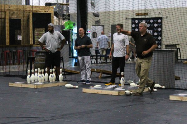 Throw bowling image with 3 men playing