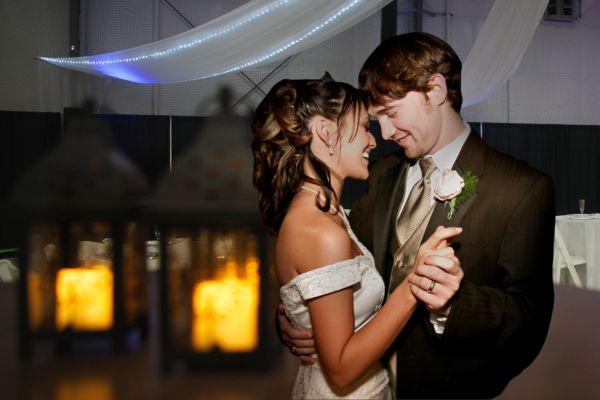 bride and groom dancing close together at wedding reception