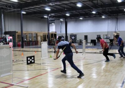 corporate archery tag games with 3 men