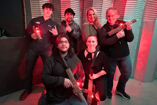 group of employees playing laser tag