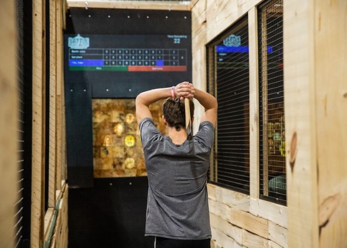 Axe throwing lane with male throwing at BGR Event Center