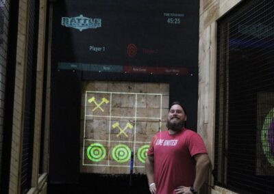 man in front of axe throwing smiling at BGR Event Center